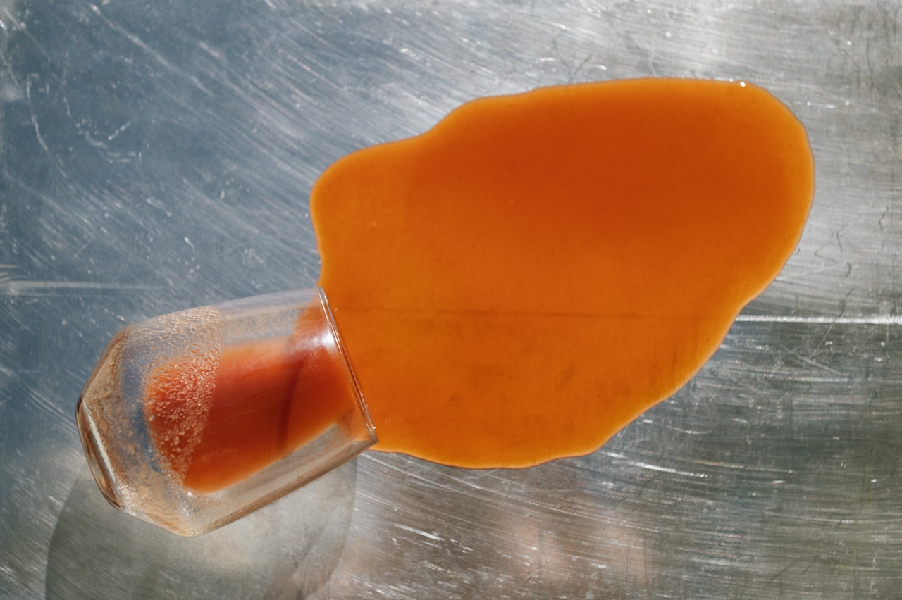 An overturned glass and spilled sauce during service