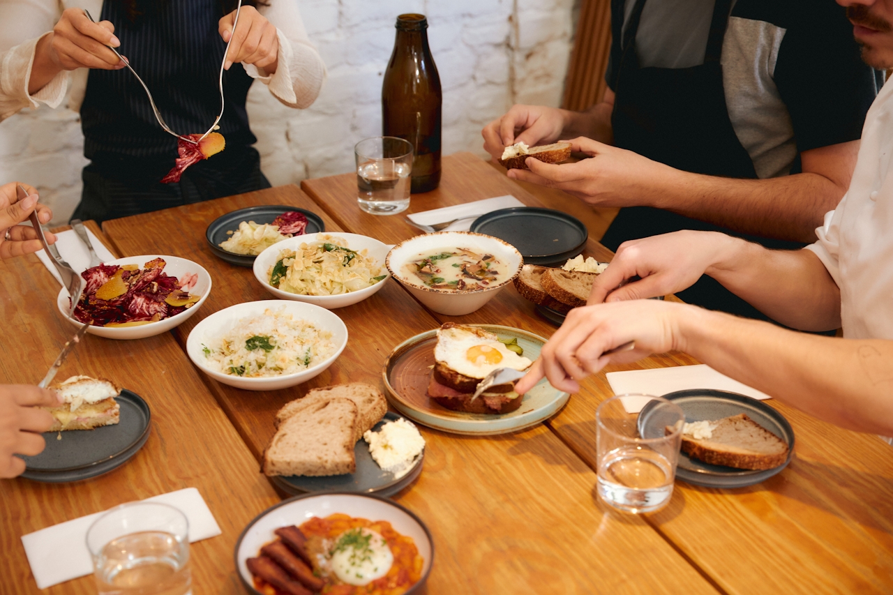 Guests sharing a lively restaurant table